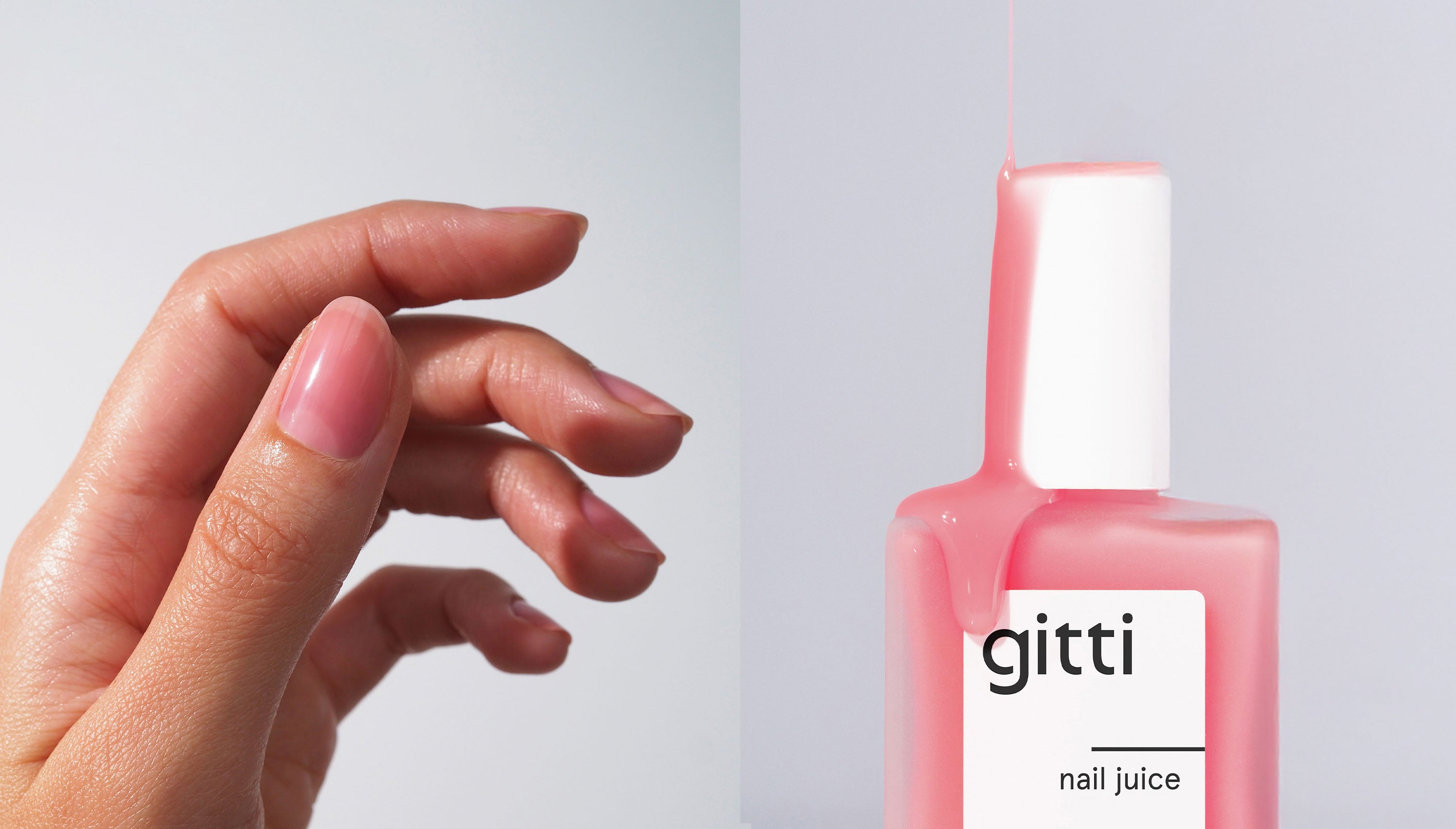 gitti nail juice bottle next to a hand with pink healthy clean nails on a light gray background