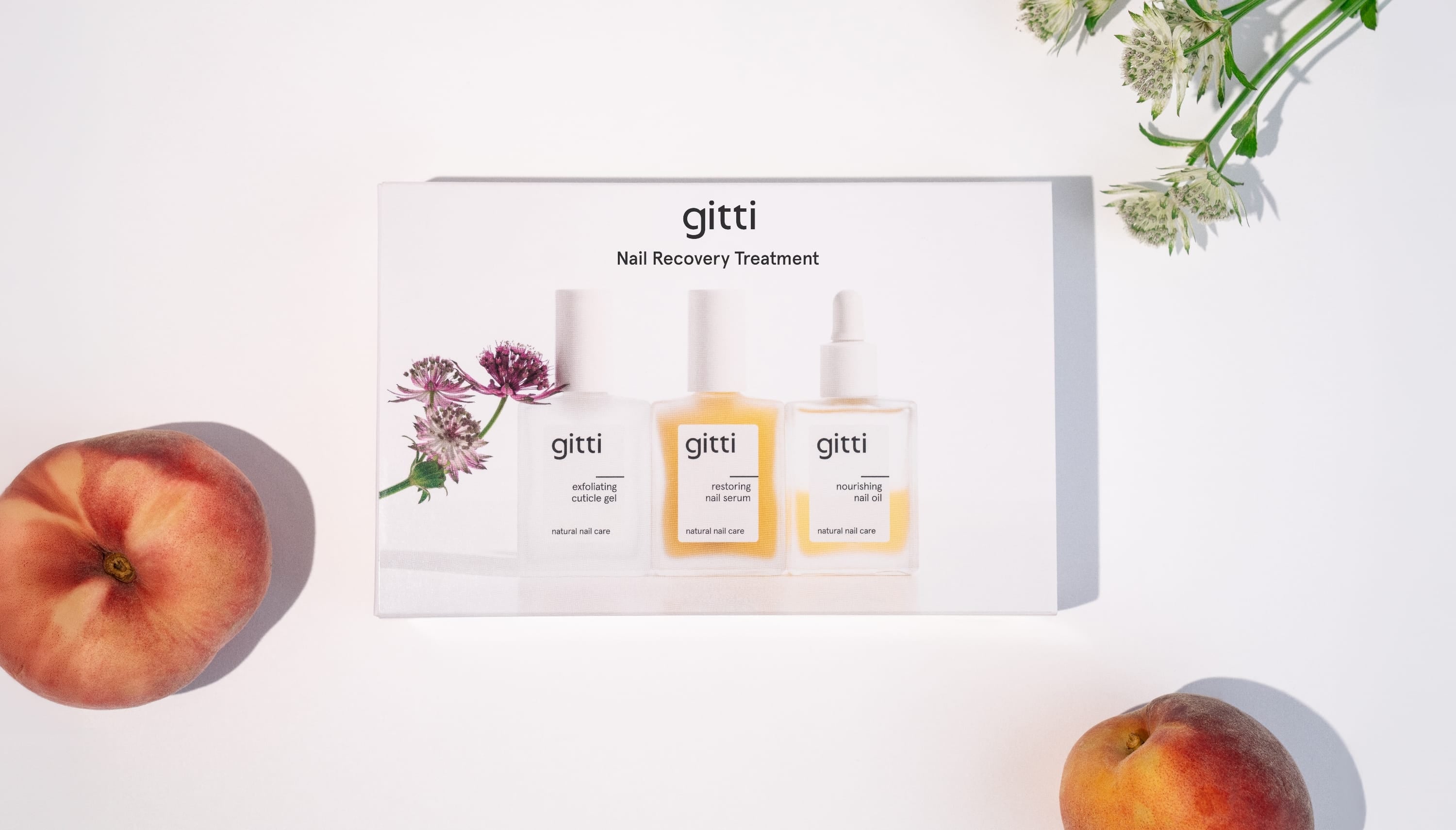 gitti nail recovery treatment set with bottles and packaging on a white background