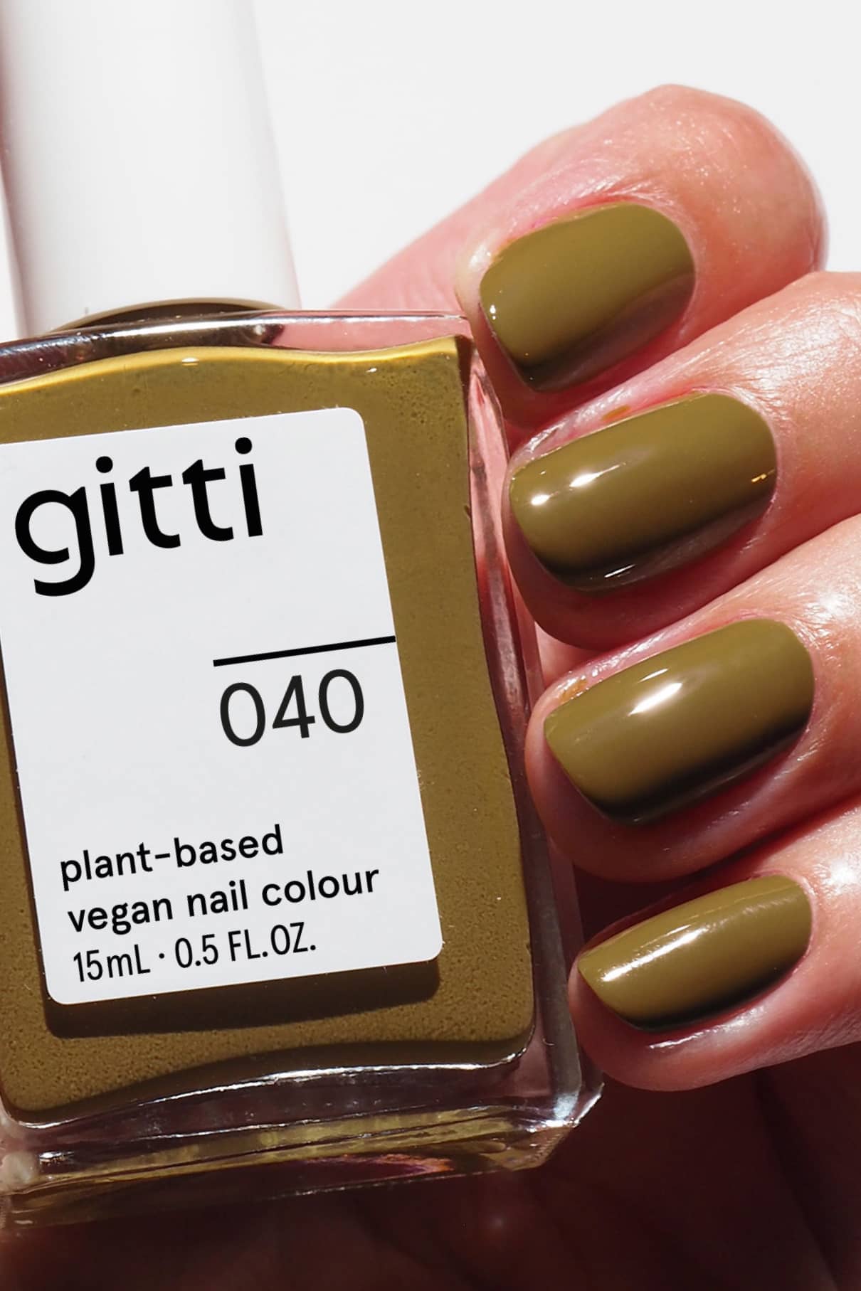 gitti plant-based vegan nail polish with a hand displaying green nails.