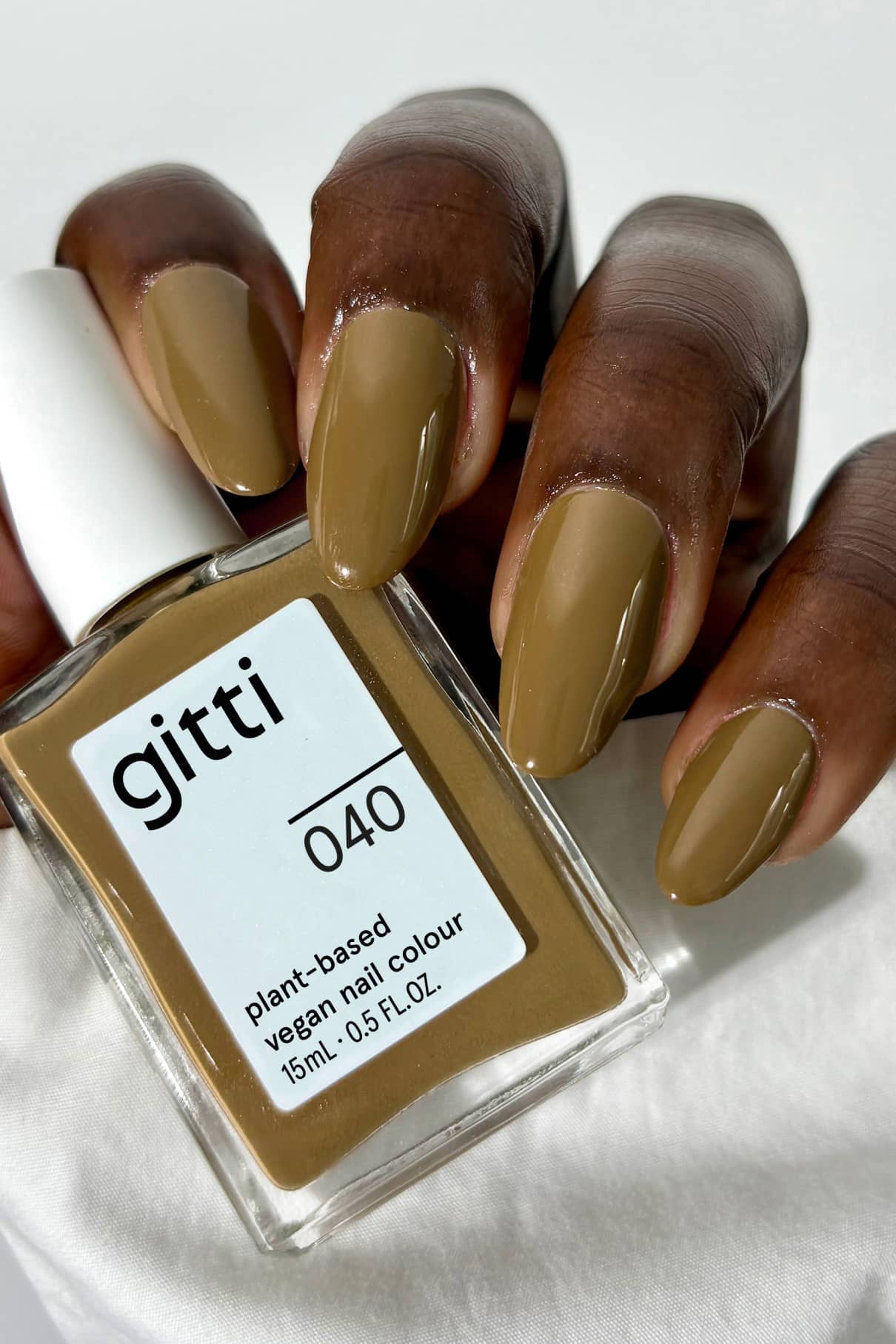 gitti nail polish bottle and olive green nail polish